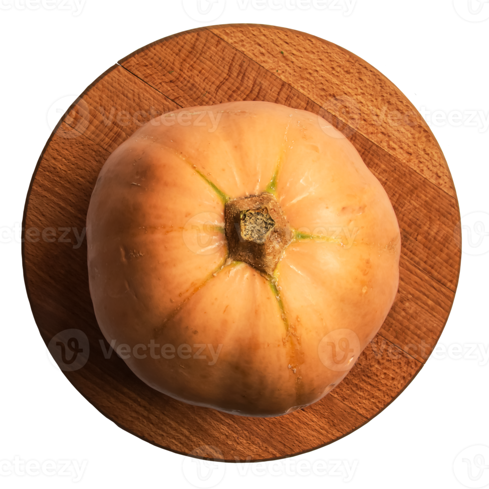 Fresh orange pumpkin with green veins on wooden board top view. Halloween preparation. png