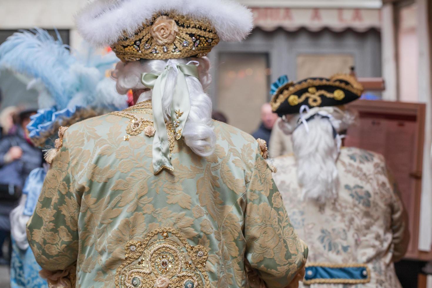 Venice, Italy - February, 2019 Carnival of Venice, typical Italian tradition and festivity with masks photo