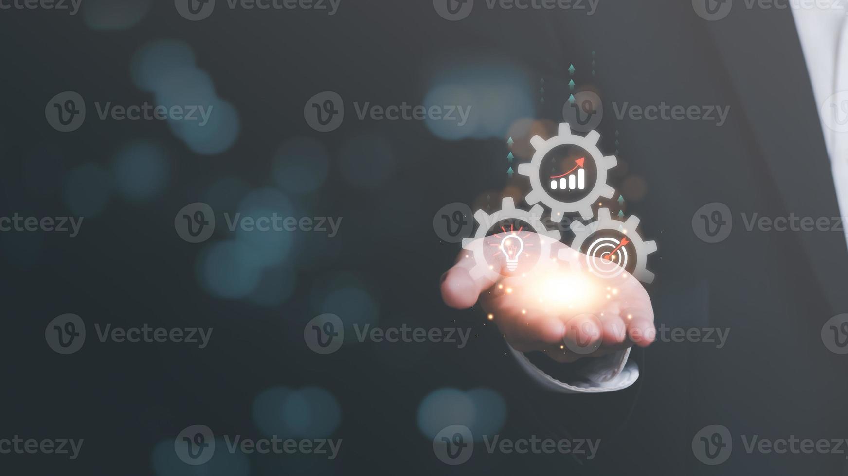 businessman showing growth icons and business goals,concept of progress in development, financial efficiency and investment with business strategy for goals and opportunities in industry future photo
