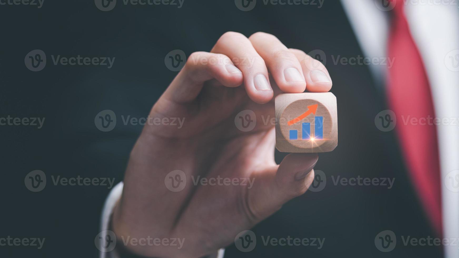 Businessman showing business growth and success graph ,concept of progress in development, financial efficiency and investment with business strategy for goals and opportunities in the industry future photo