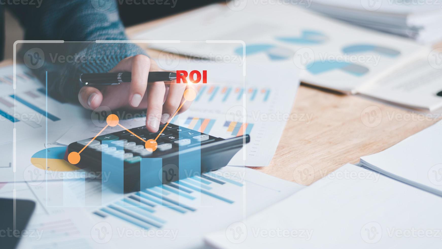 Analyst read business statistics chart reports, to analyze and improve corporate strategy, manage financial and marketing documents, update annual budget accounts, ROI, Return on investment photo