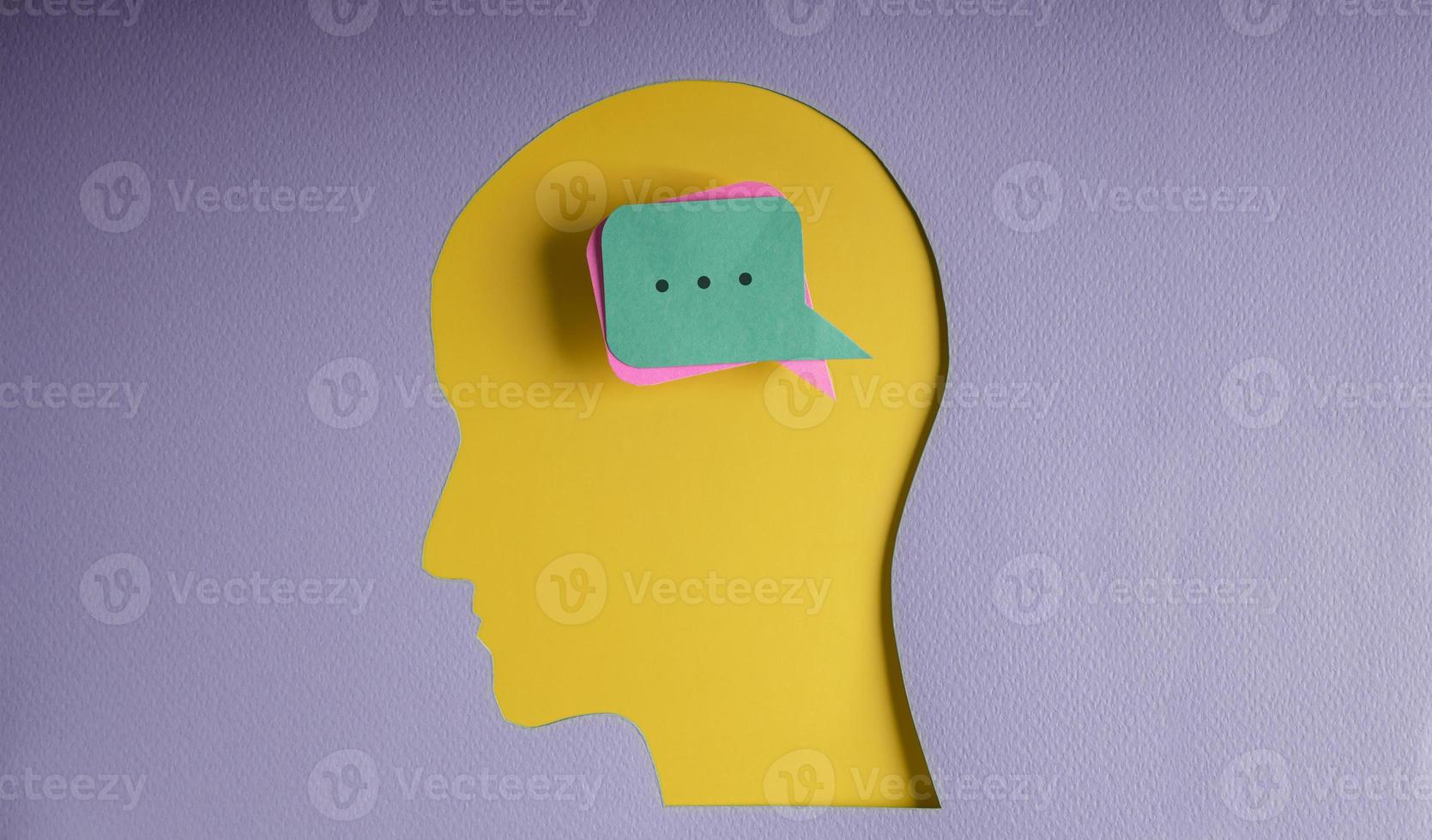 Conceptual Photo. Speak Your Mind, Voices, Saying with Smart Brain Concepts. Paper Cut as Speech Bubble Heart Lay on Human Head photo