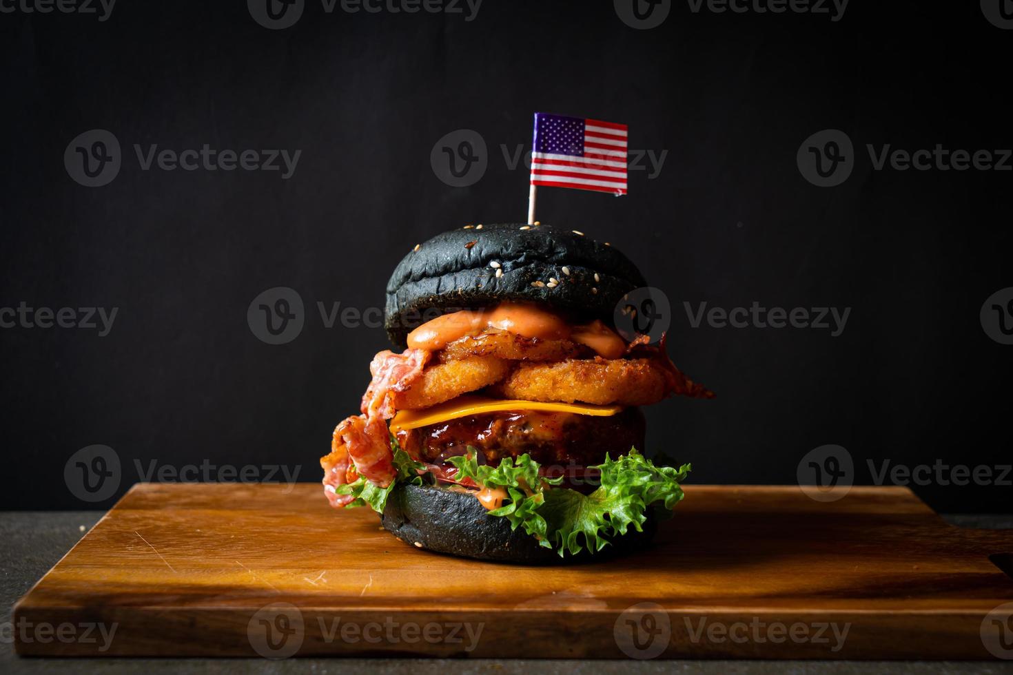 barbecue burger - pork with barbecue sauce with cheese, onion rings and bacon burger photo