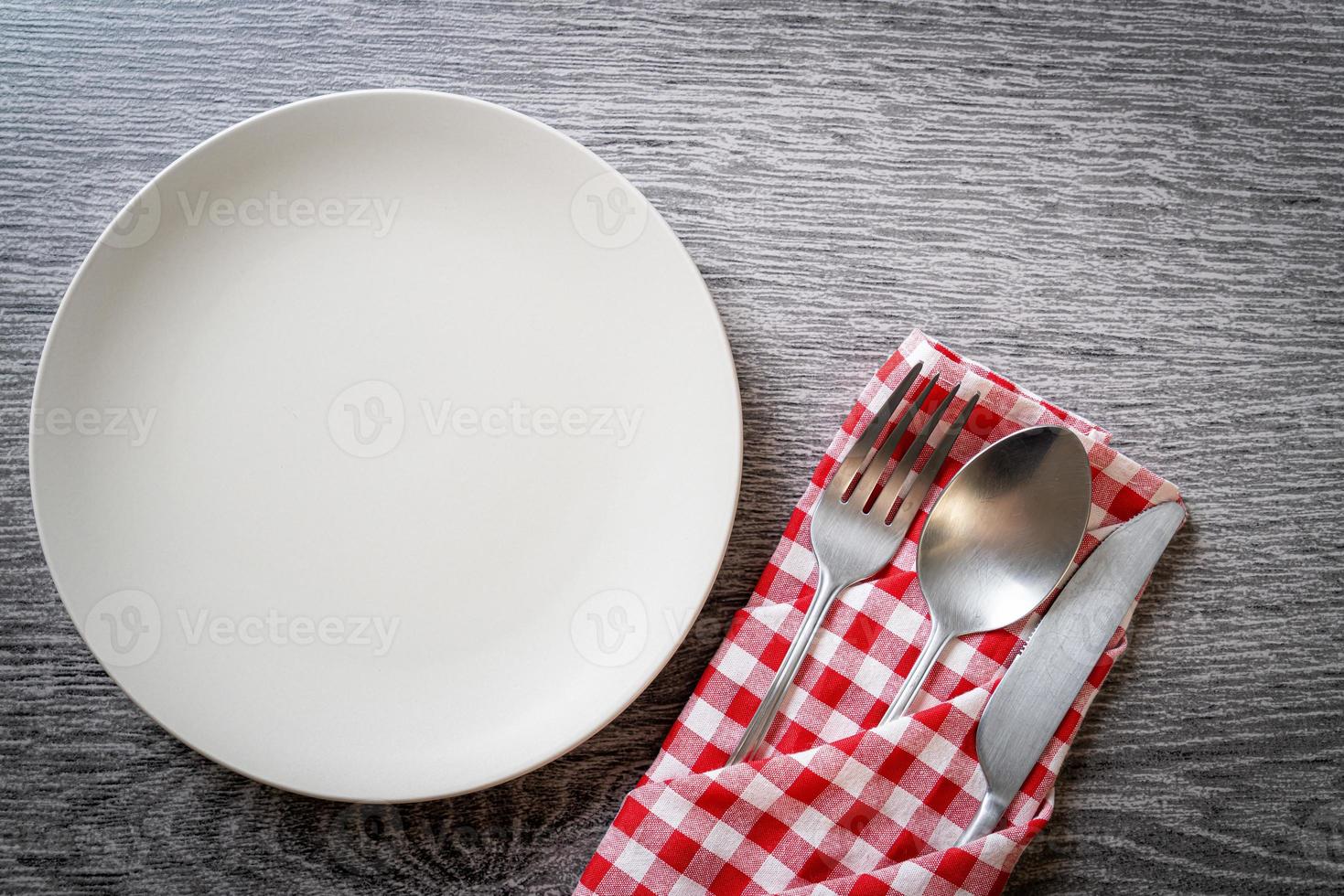 empty plate or dish with knife, fork and spoon photo
