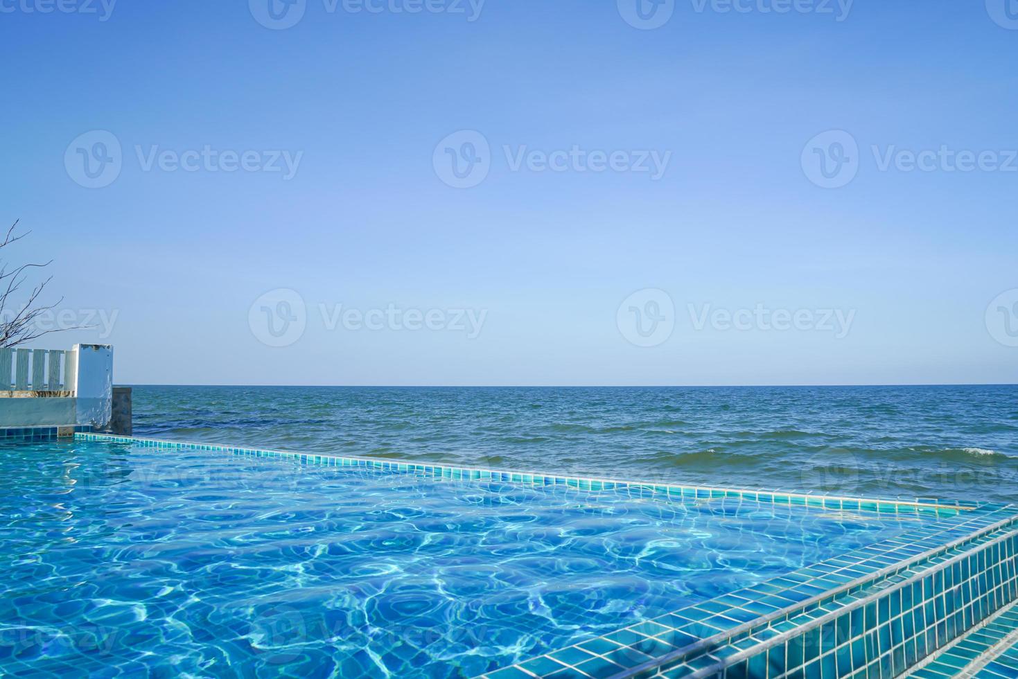 swimming pool with sea background photo