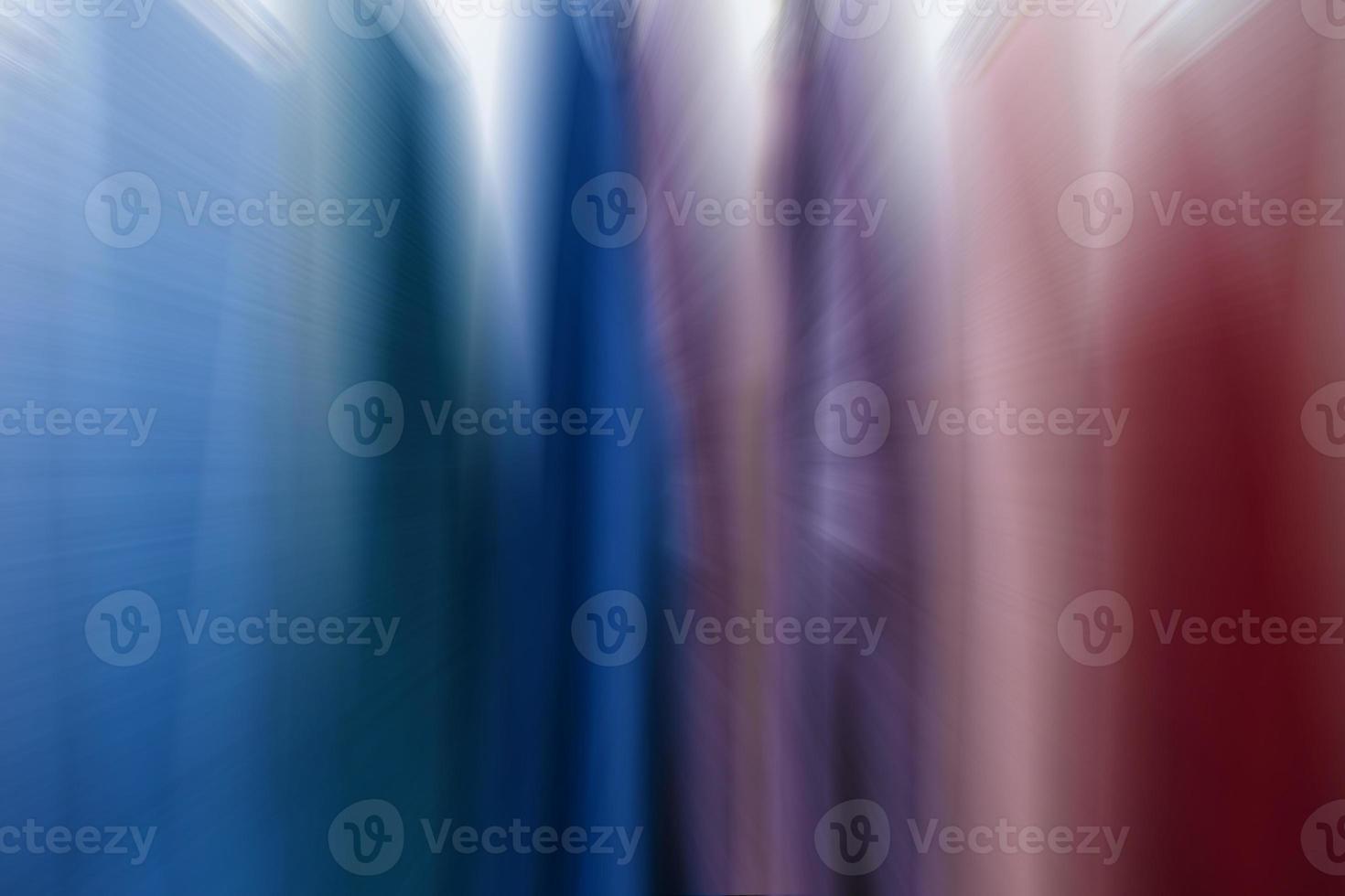 Multicolored defocused background from blue and red stripes. photo