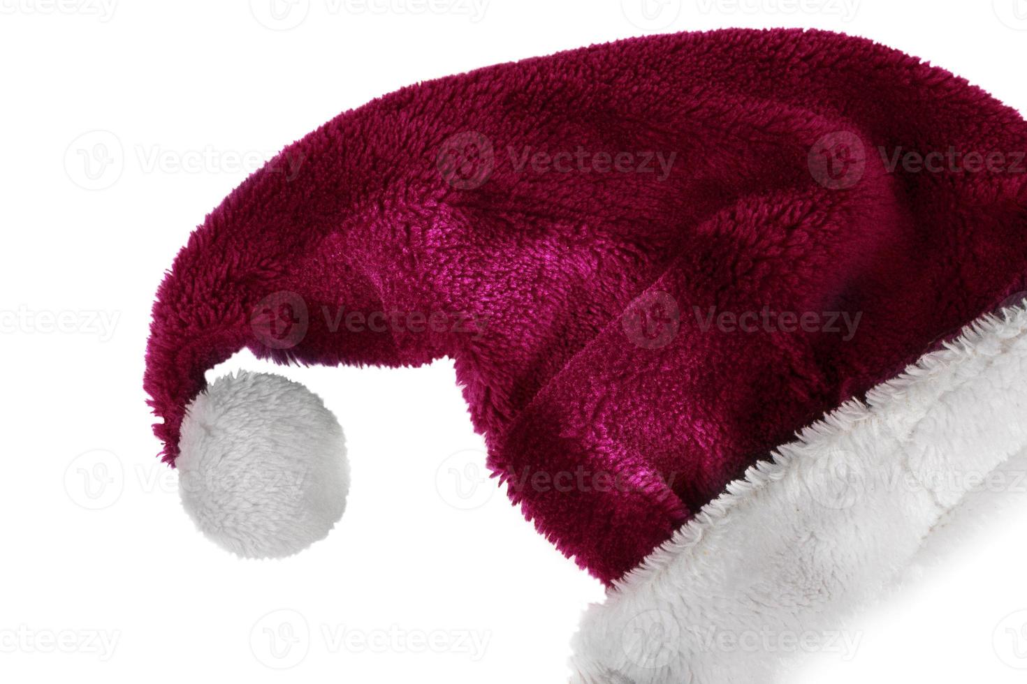 sombrero de navidad sobre un fondo blanco. sombrero rojo de santa claus con pompón blanco. foto