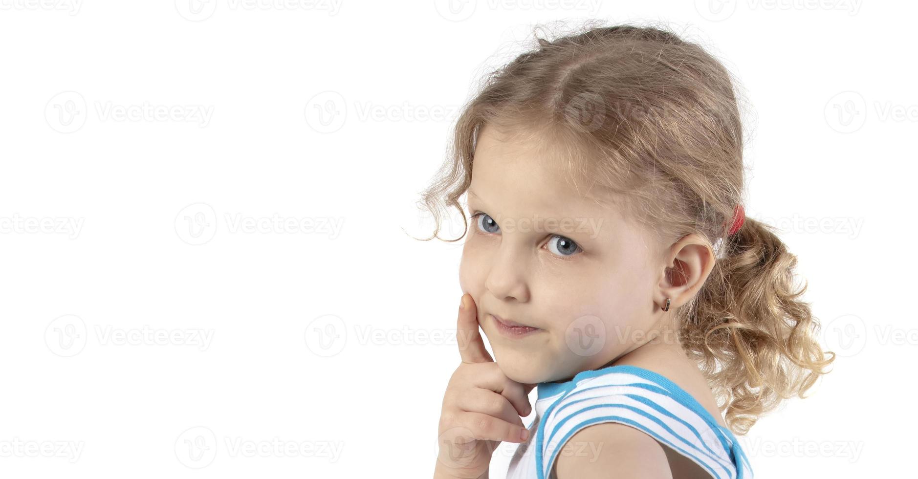Close-up of a little girl's face. Portrait of a four-year-old girl on a white background. photo