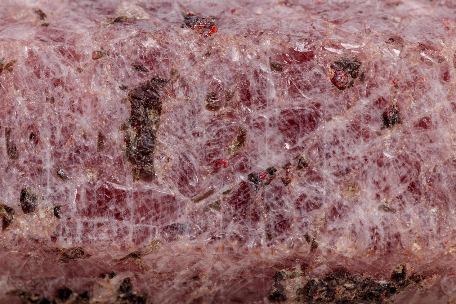 Macro mineral stone Ruby in the breed a white background photo