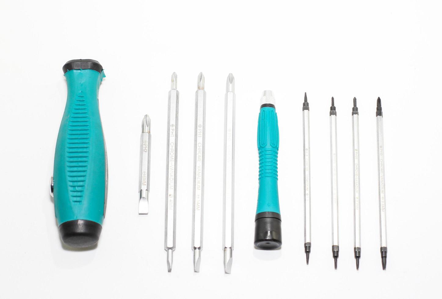 Tool set screwdriver with replaceable bits, on the White background photo