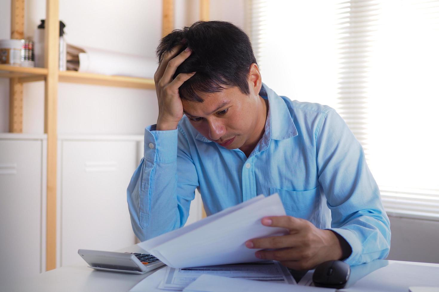 Tired and anxious business people who work in the office after a mistake photo