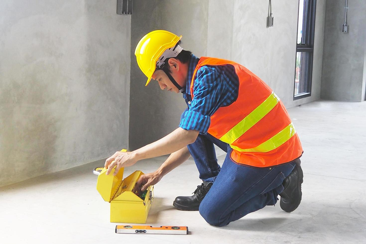 Civil engineer with open tool box Is preparing to start photo