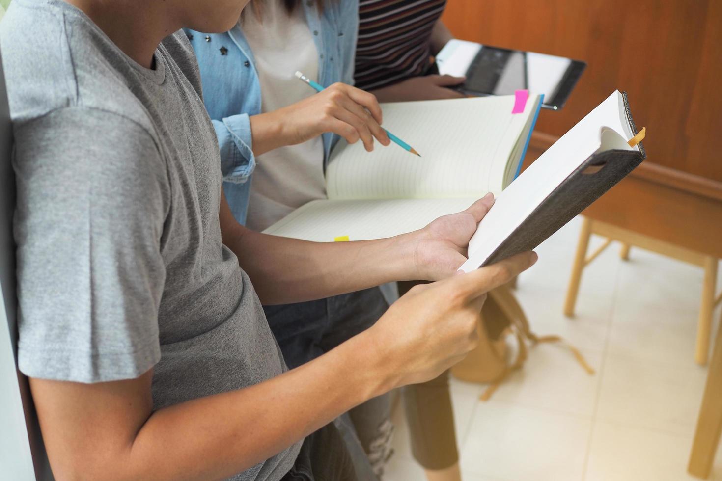 High school or college students are helping to teach. Share knowledge,  brainstorm and studying together concept photo