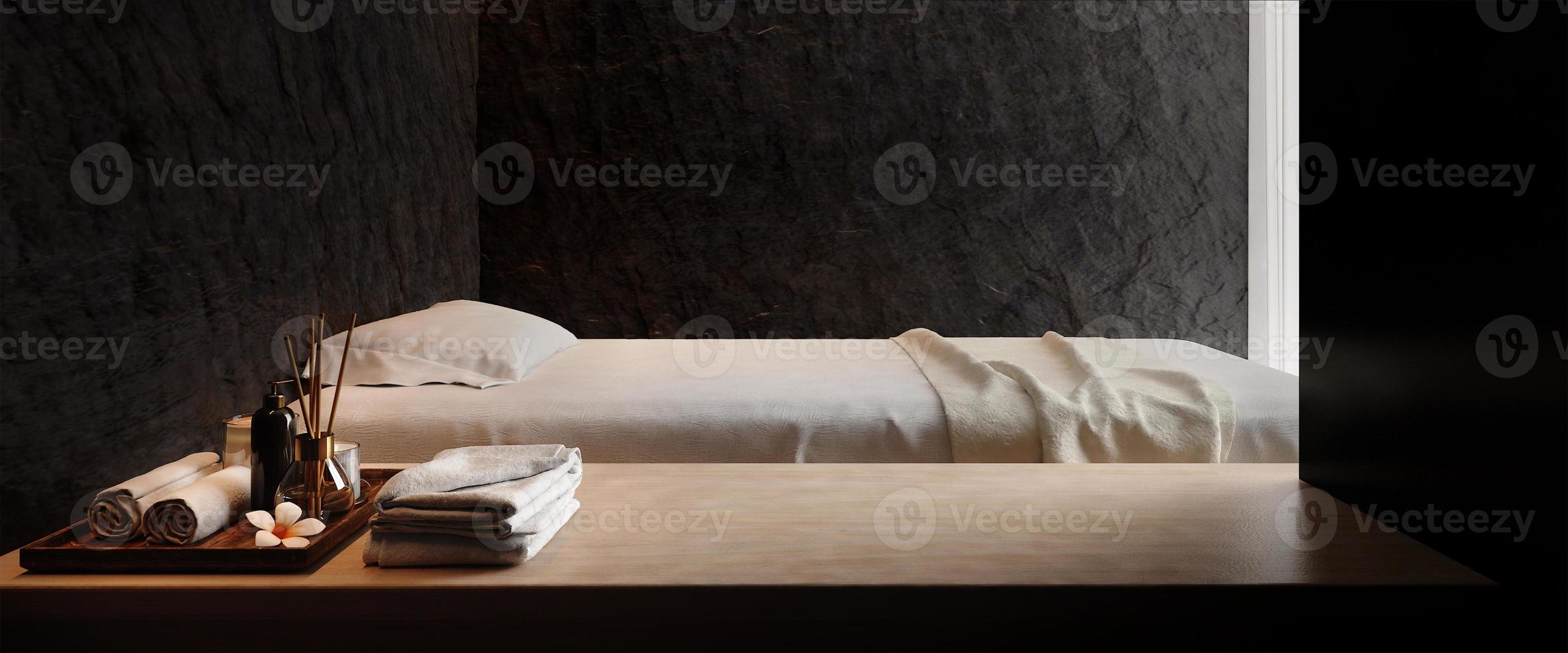 Spa and massage bed with dark stone wall background.3d rendering photo