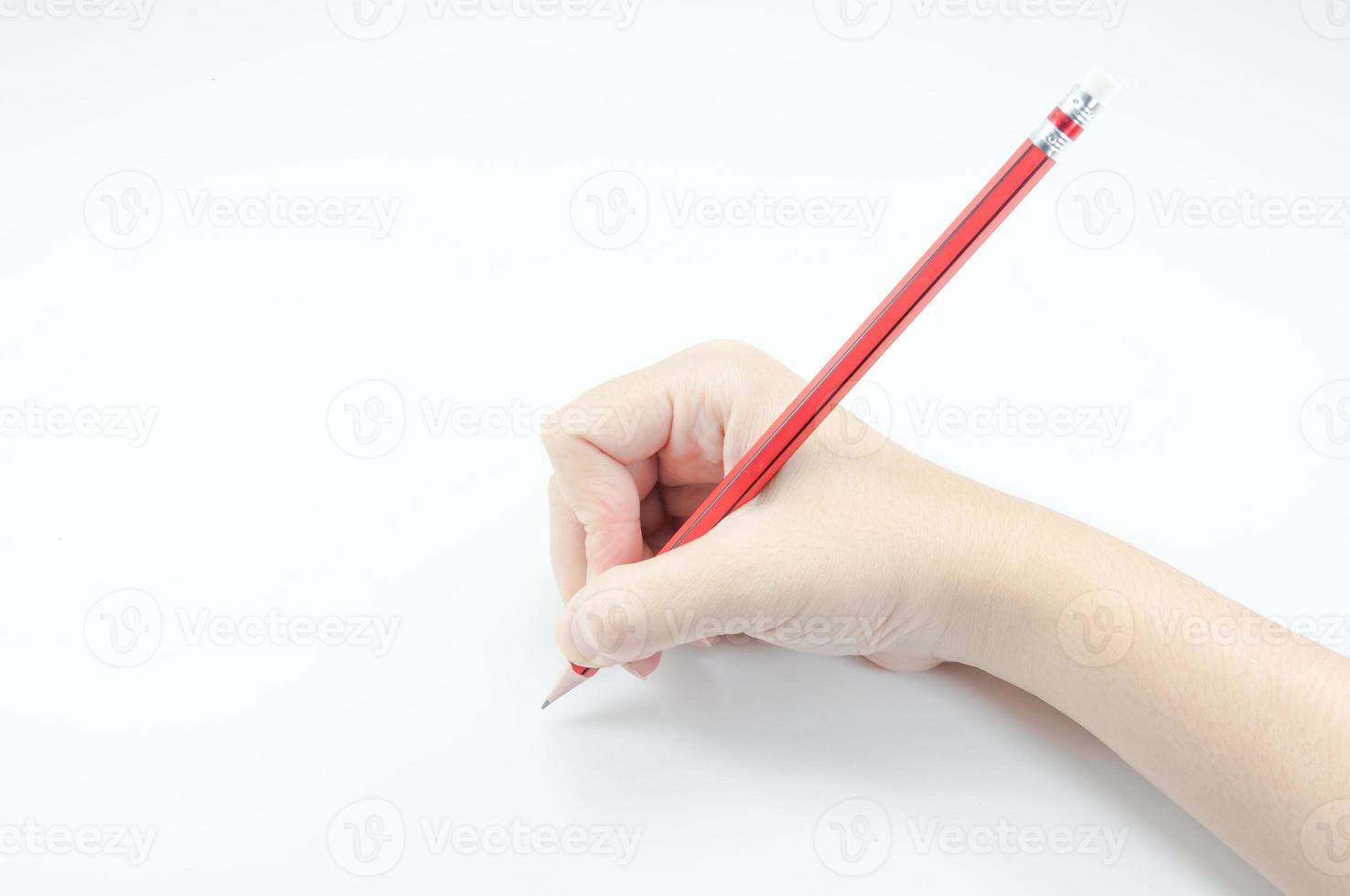 Woman's hand holding with red pencil  on white background photo