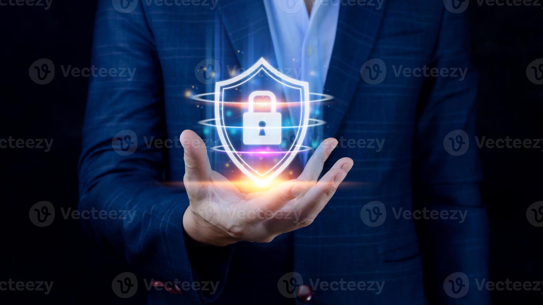 Computer network protection, secure and safe your data concept, businessman holding shield protection icon, Security shield Lock Security Businessman Protect Concept photo