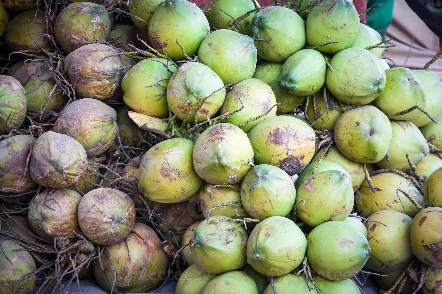 Green coconut pile,fresh coconut water isotonic drink photo