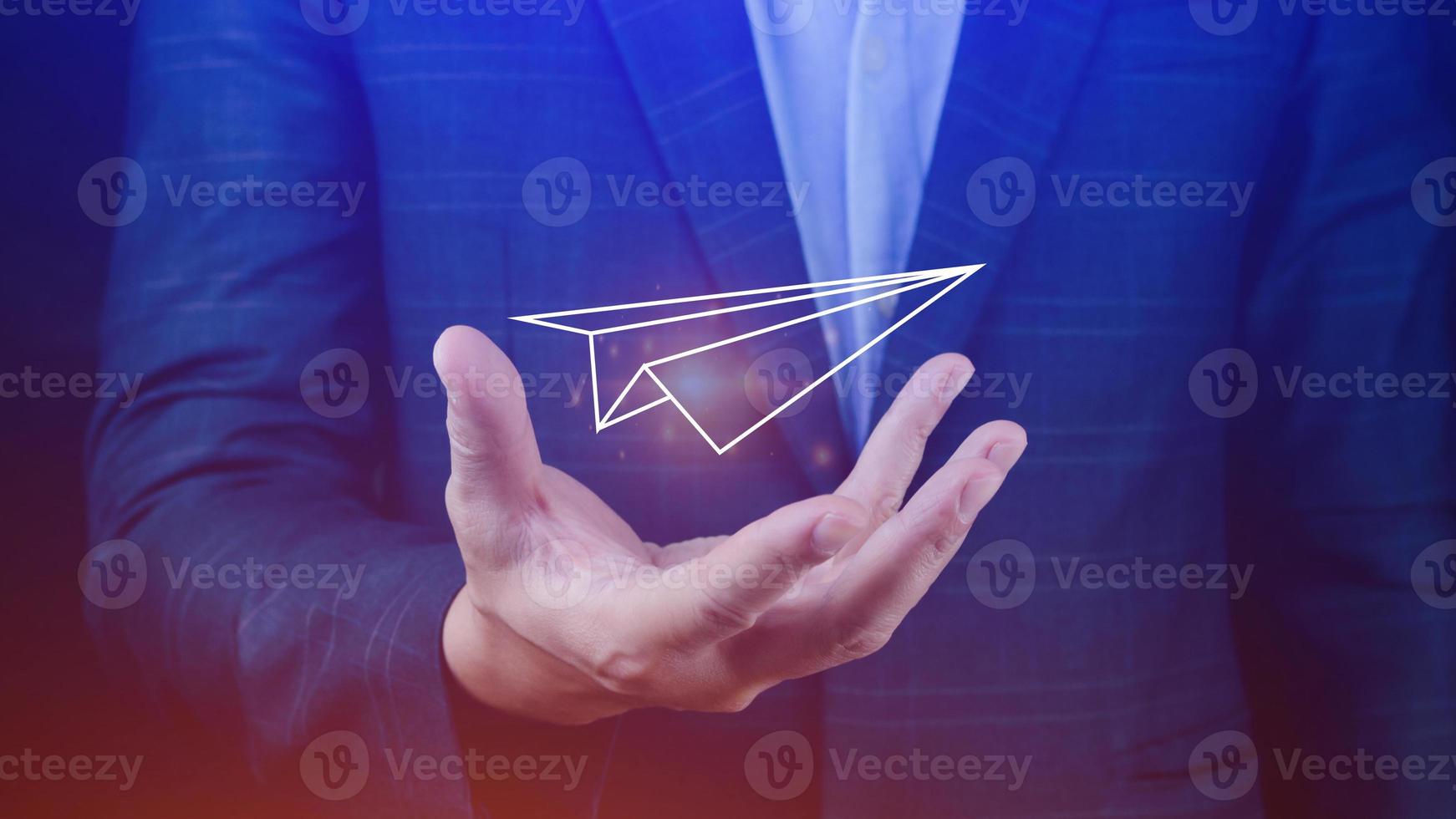 Businessman holding Paper airplane takes ,concept of communication and message forwarding, future connection concept, telecommunication photo