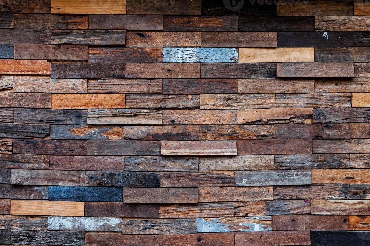 exposed wooden wall exterior, patchwork of raw wood forming a beautiful parquet wood pattern,Wood wall pattern photo