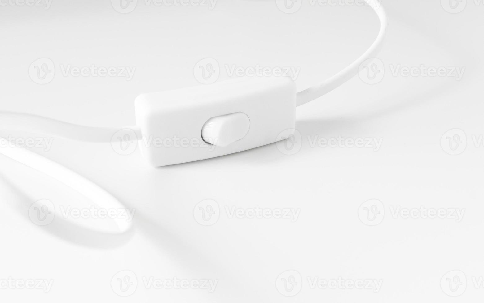 lighting switch under the white background , selective focus photo