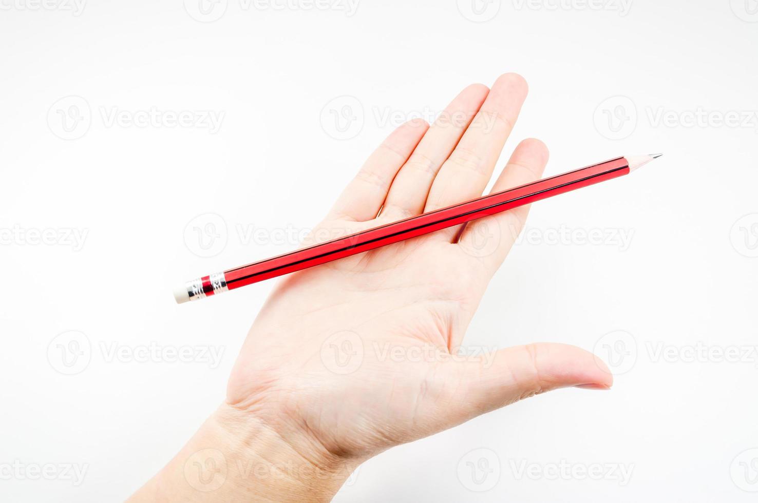 Red pencil on hand woman on white background photo