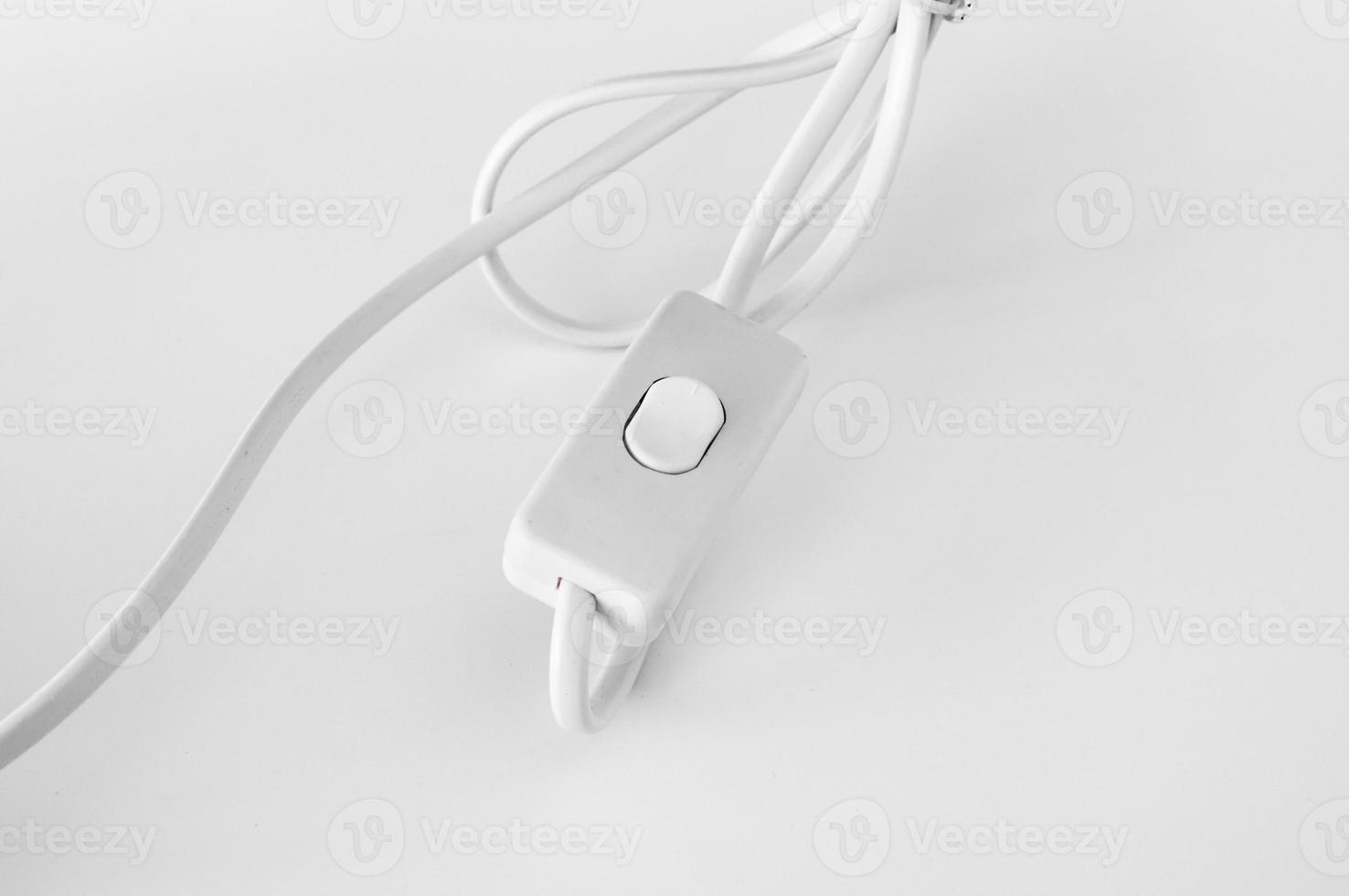 lighting switch under the white background , selective focus photo
