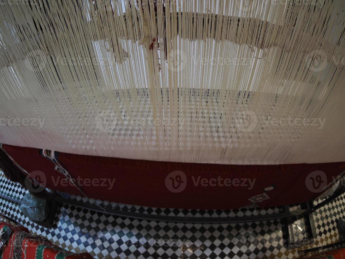 Moroccan handmade carpet at a shop in Medina of Fez, Morocco. photo