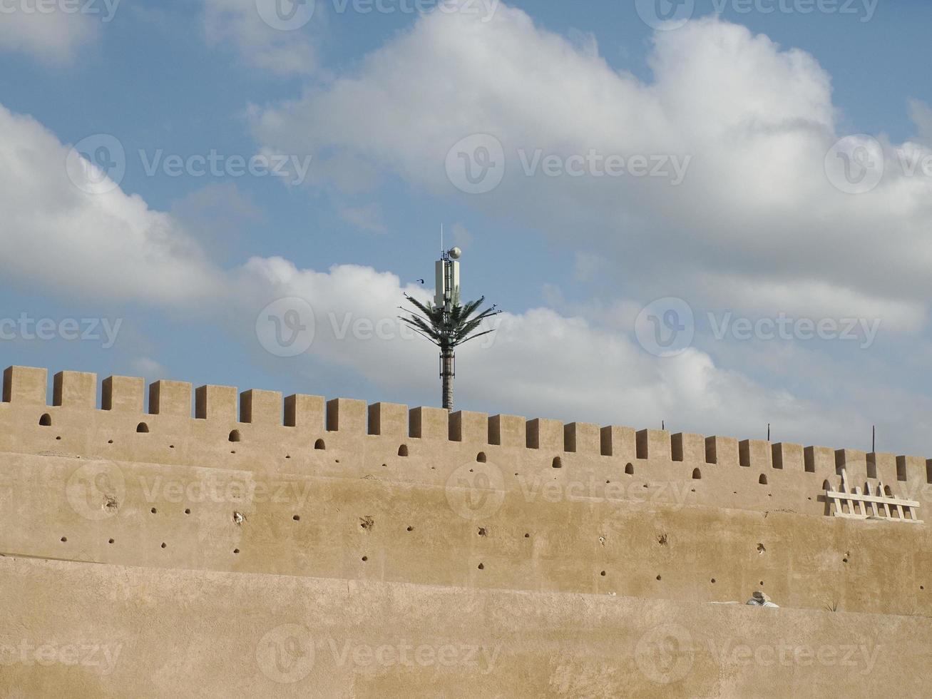 Storks nest installed on a telecommunication antenna tower photo