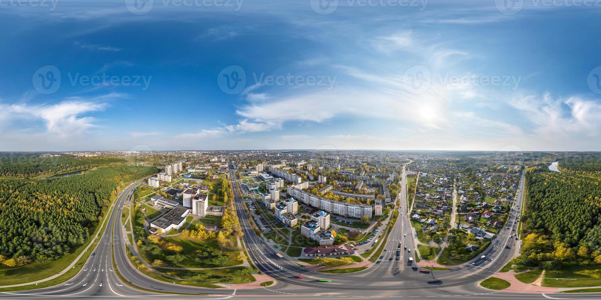 aerial full seamless spherical hdri 360 panorama view above road junction with traffic in residential complex with high-rise buildings in equirectangular projection. photo
