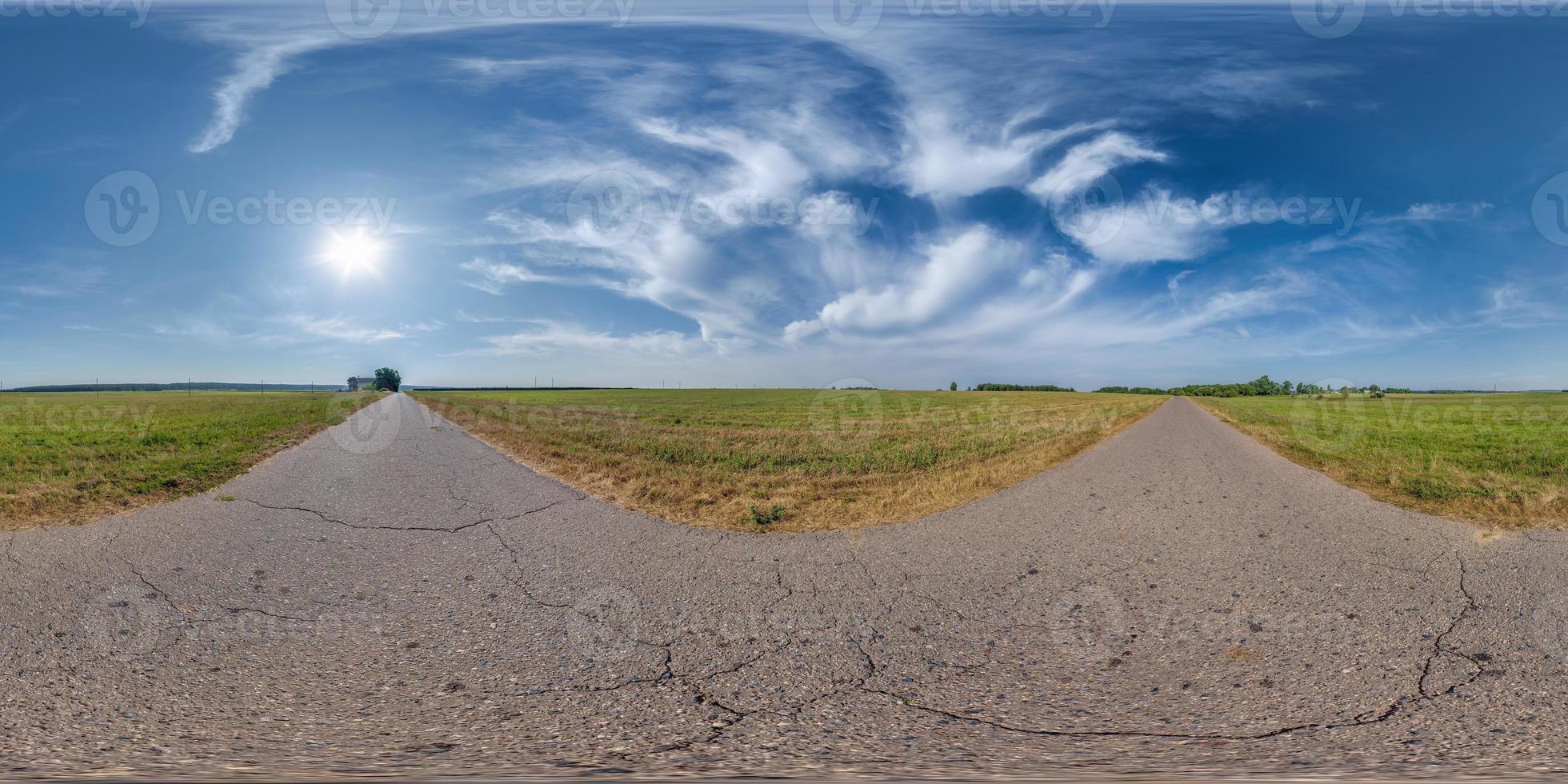 full spherical seamless hdri 360 panorama view on no traffic old asphalt road with cracks among fields with sky and clouds in equirectangular projection, VR AR content. May use like sky replacement photo