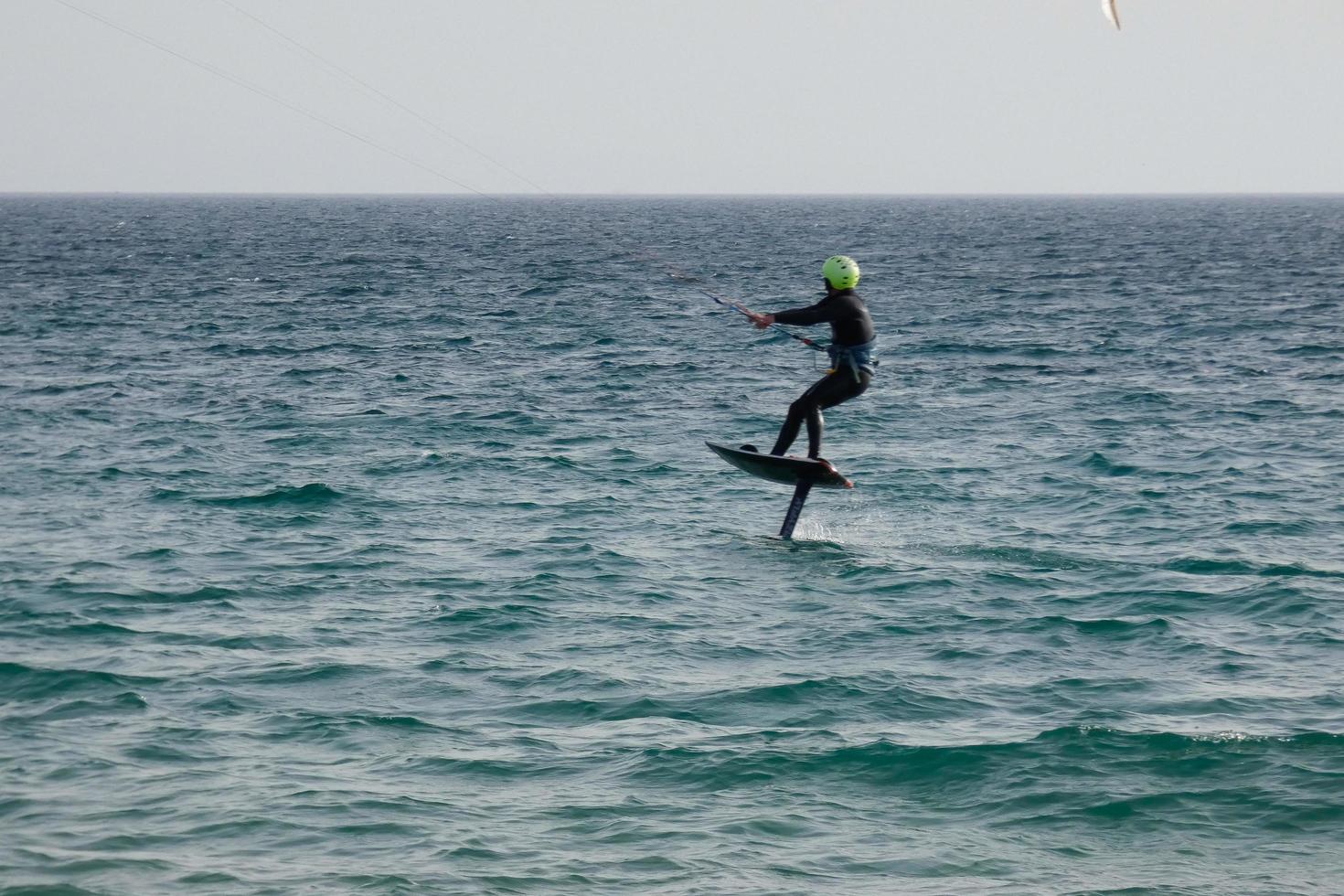 windsurfing, kitesurfing, water and wind sports powered by sails or kites photo