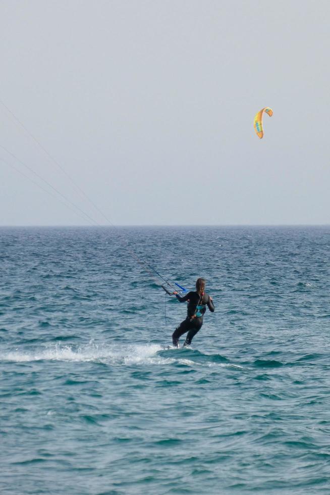 windsurfing, kitesurfing, water and wind sports powered by sails or kites photo