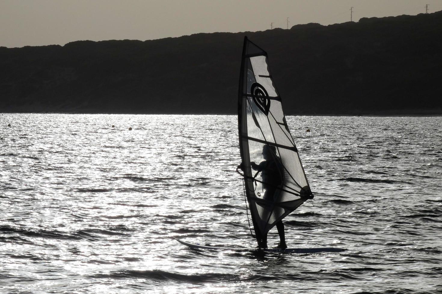 windsurfing, kitesurfing, water and wind sports powered by sails or kites photo
