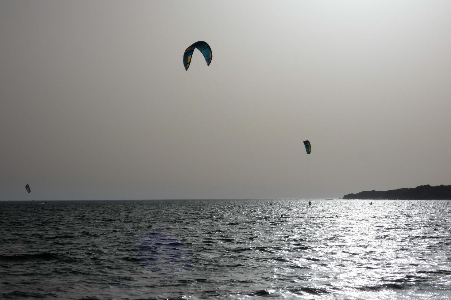 windsurfing, kitesurfing, water and wind sports powered by sails or kites photo