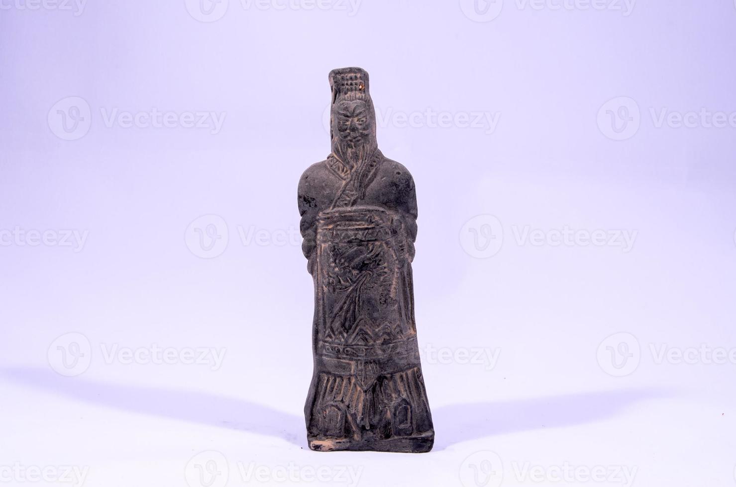 Asian statue on grey background photo