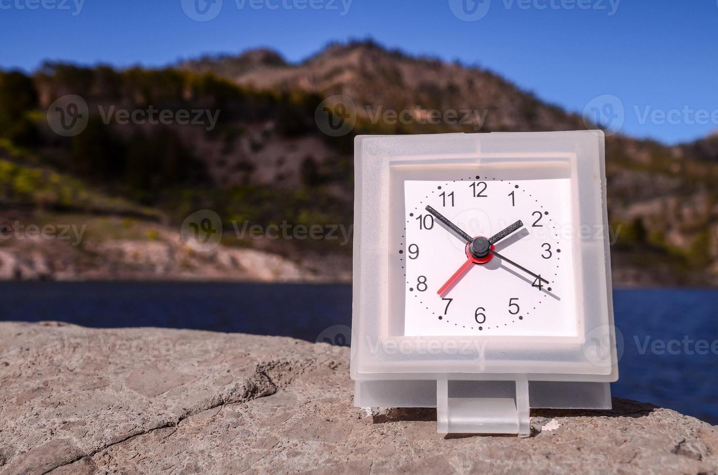 Clock by the ocean photo