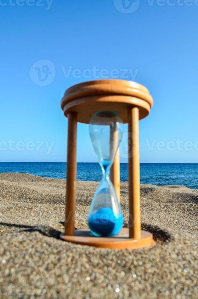 Hourglass on the beach photo