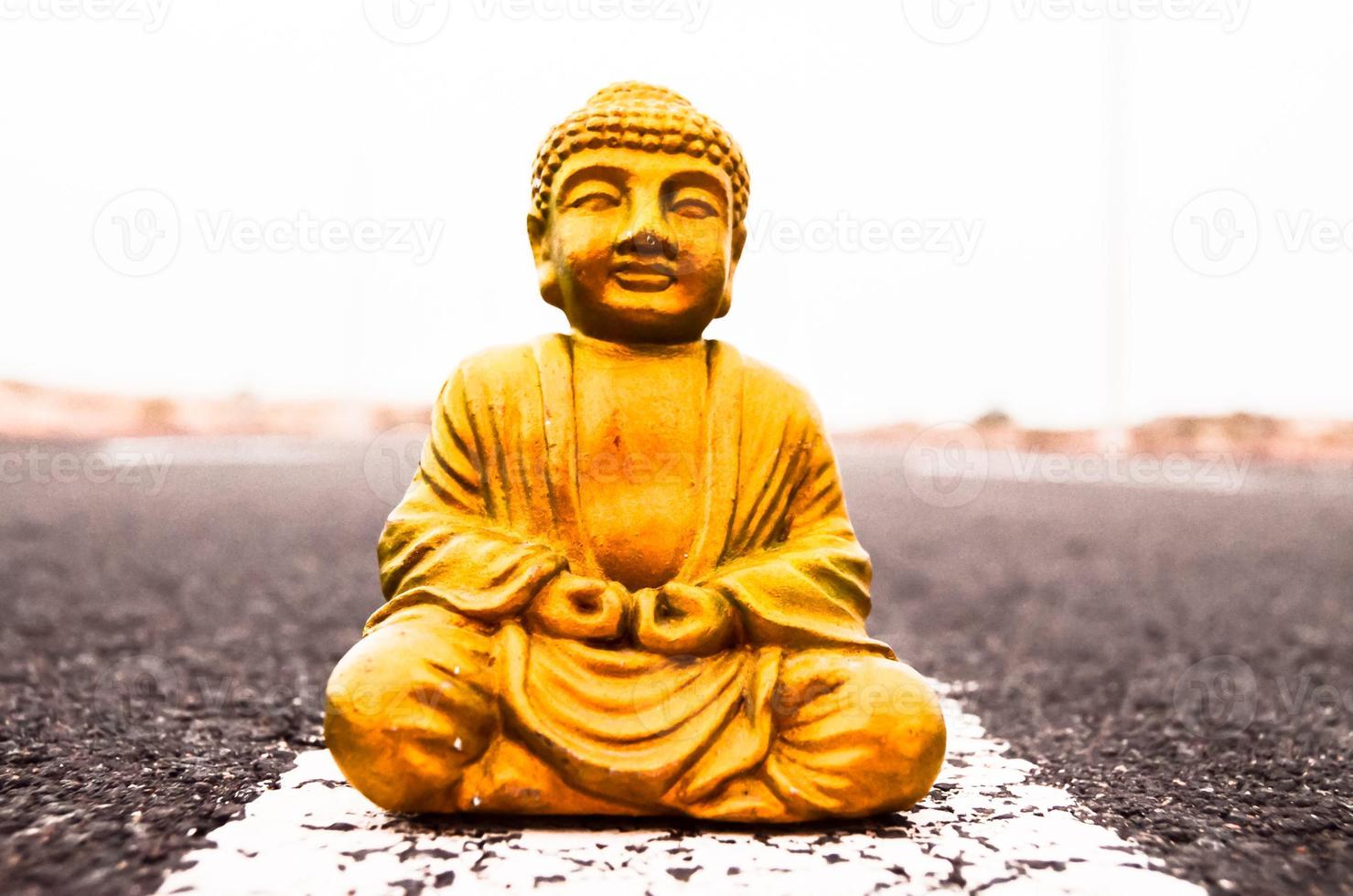 Buddha miniature on the road photo