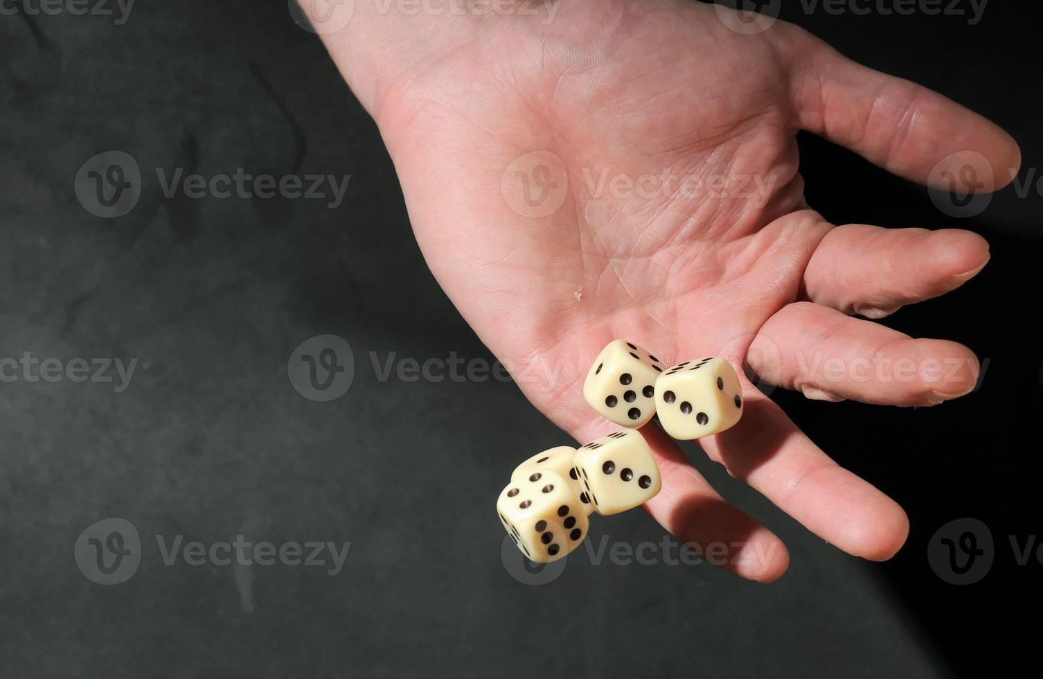 Hand throwing Dice photo