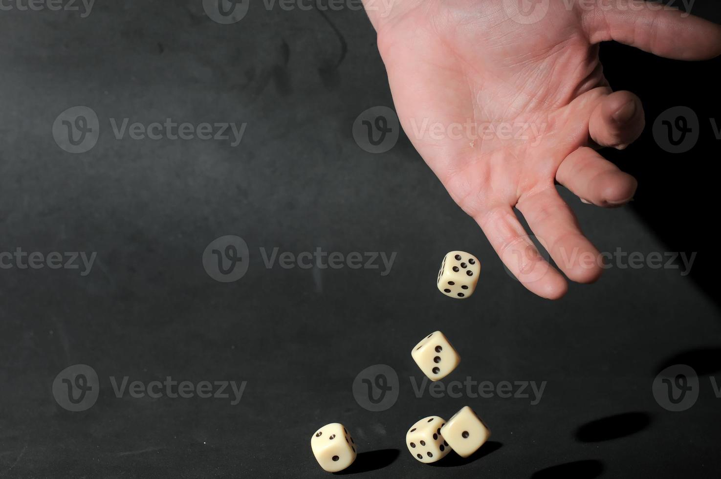 Hand throwing Dice photo