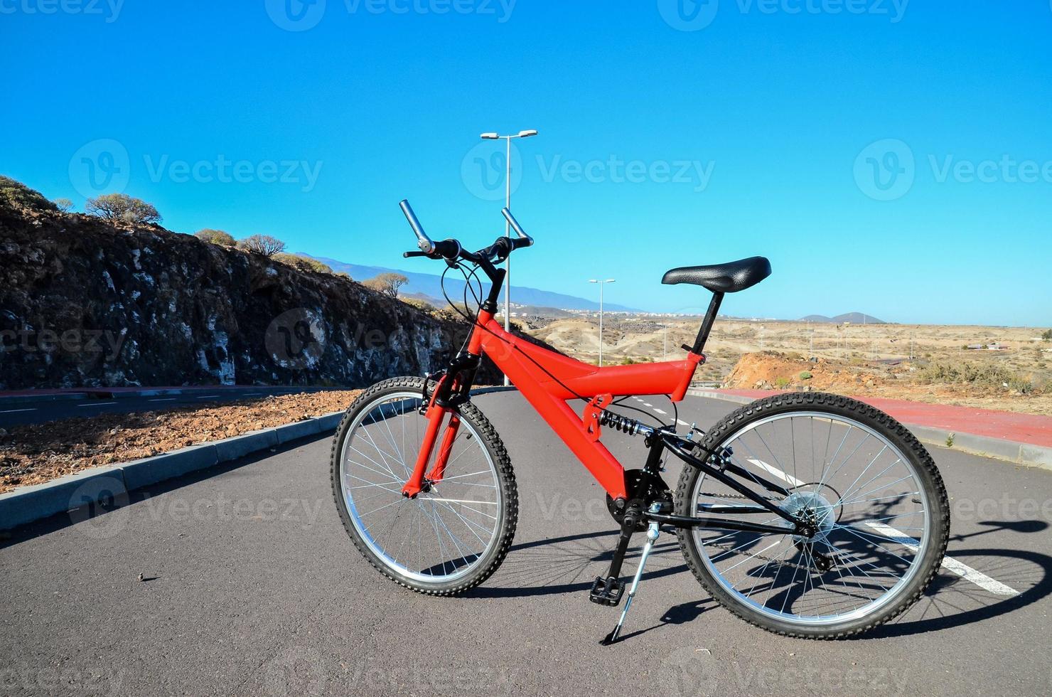 Red bicycle on the road photo
