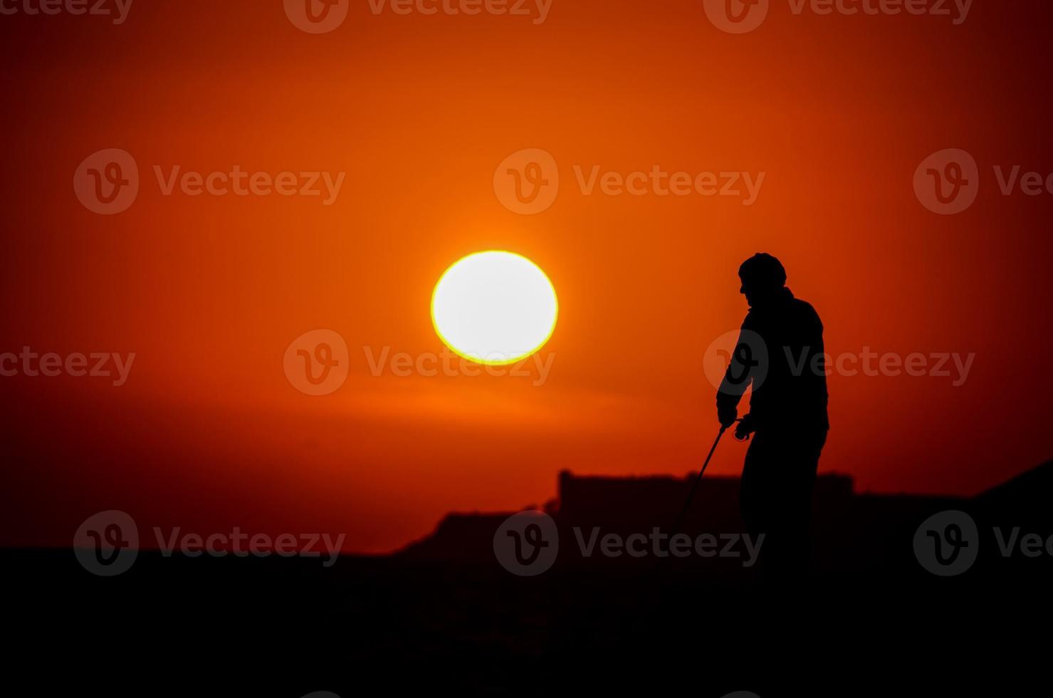Fisherman at sunset photo