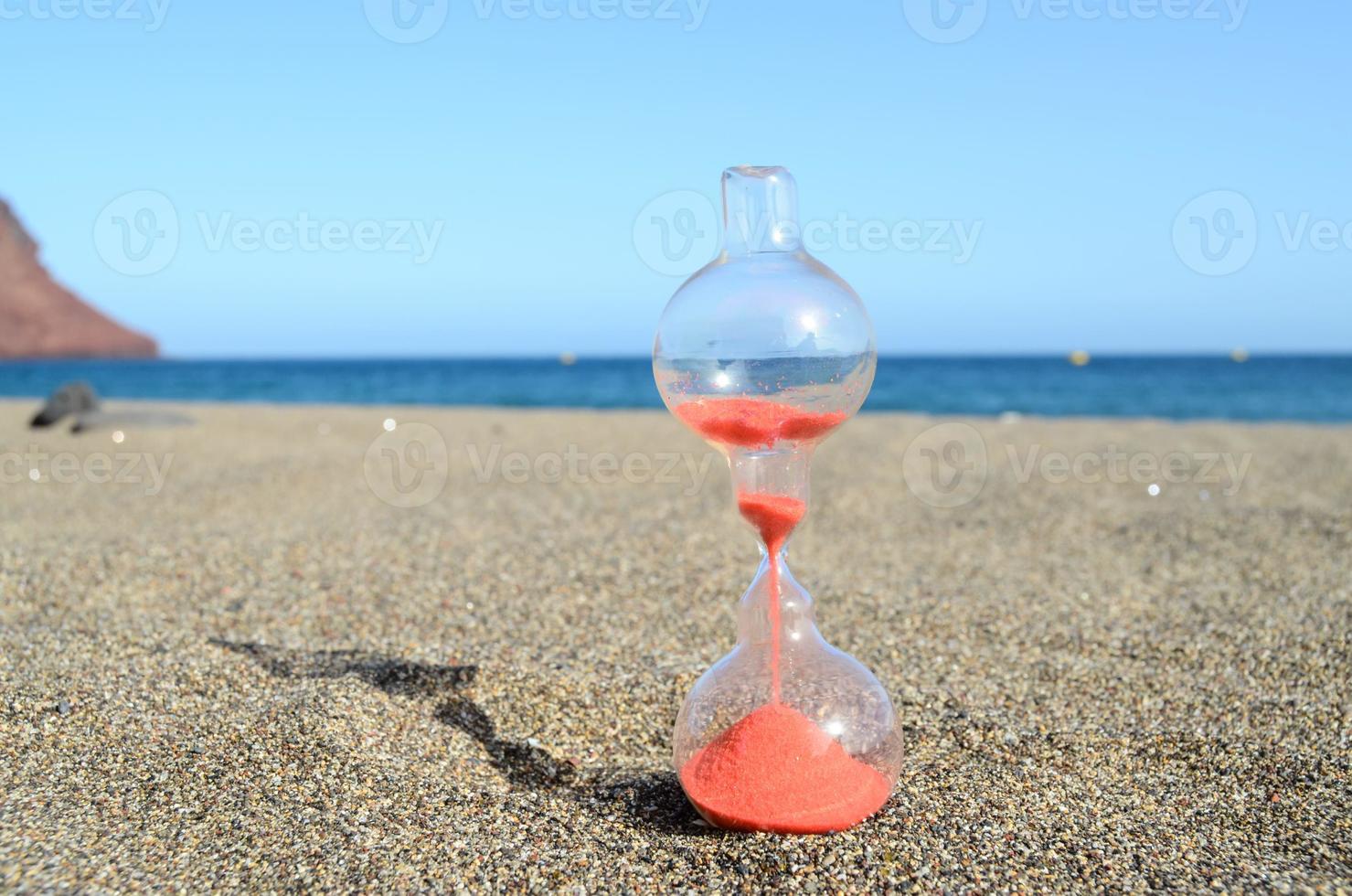 Hourglass at the beach photo