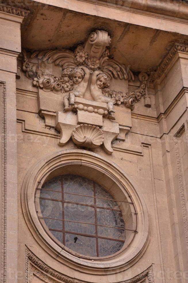 Round window on a church building photo