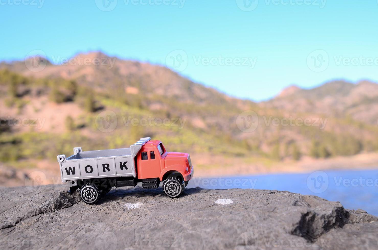 Toy truck on a rock photo