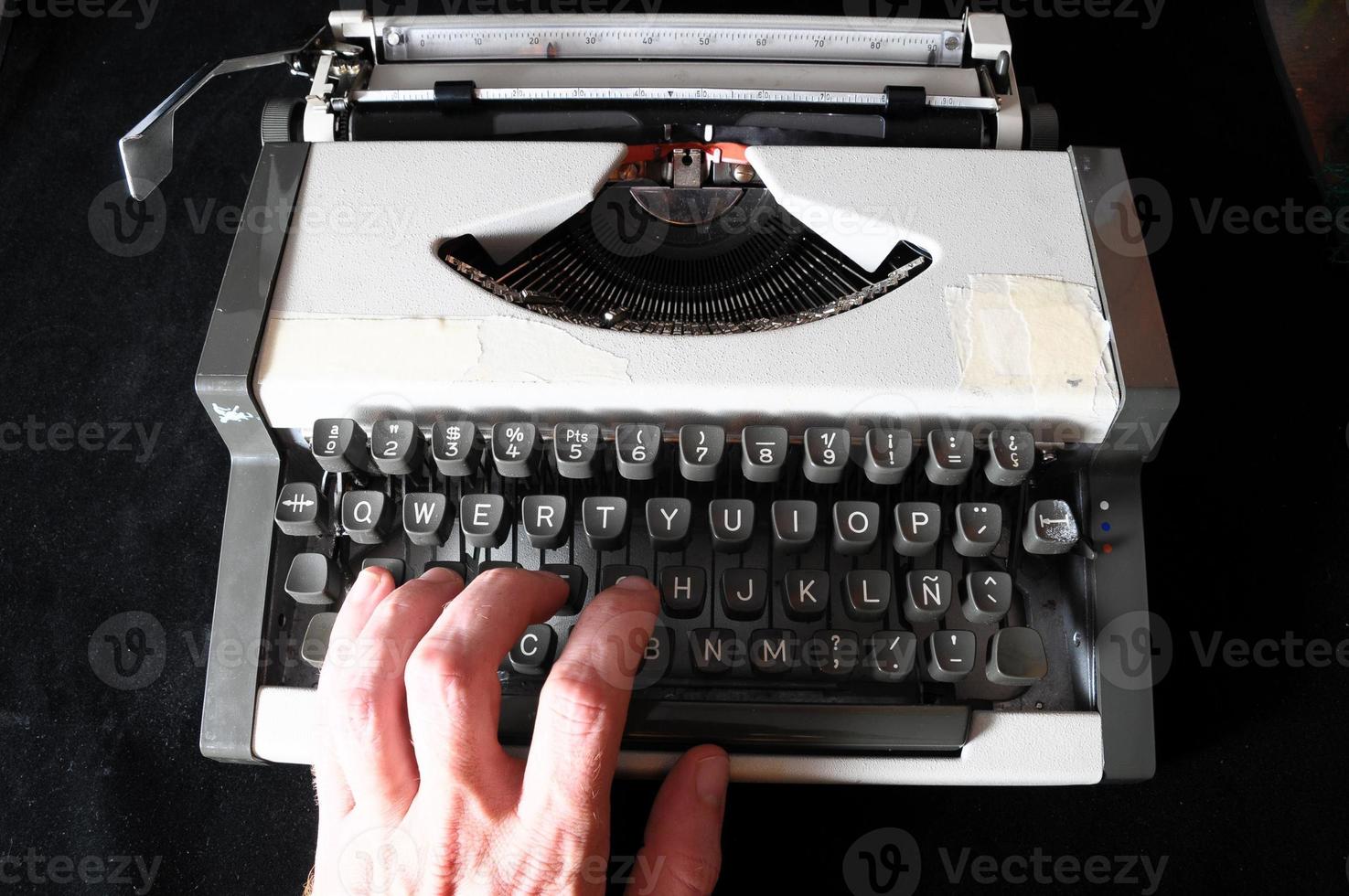 Hand on a typewriter photo