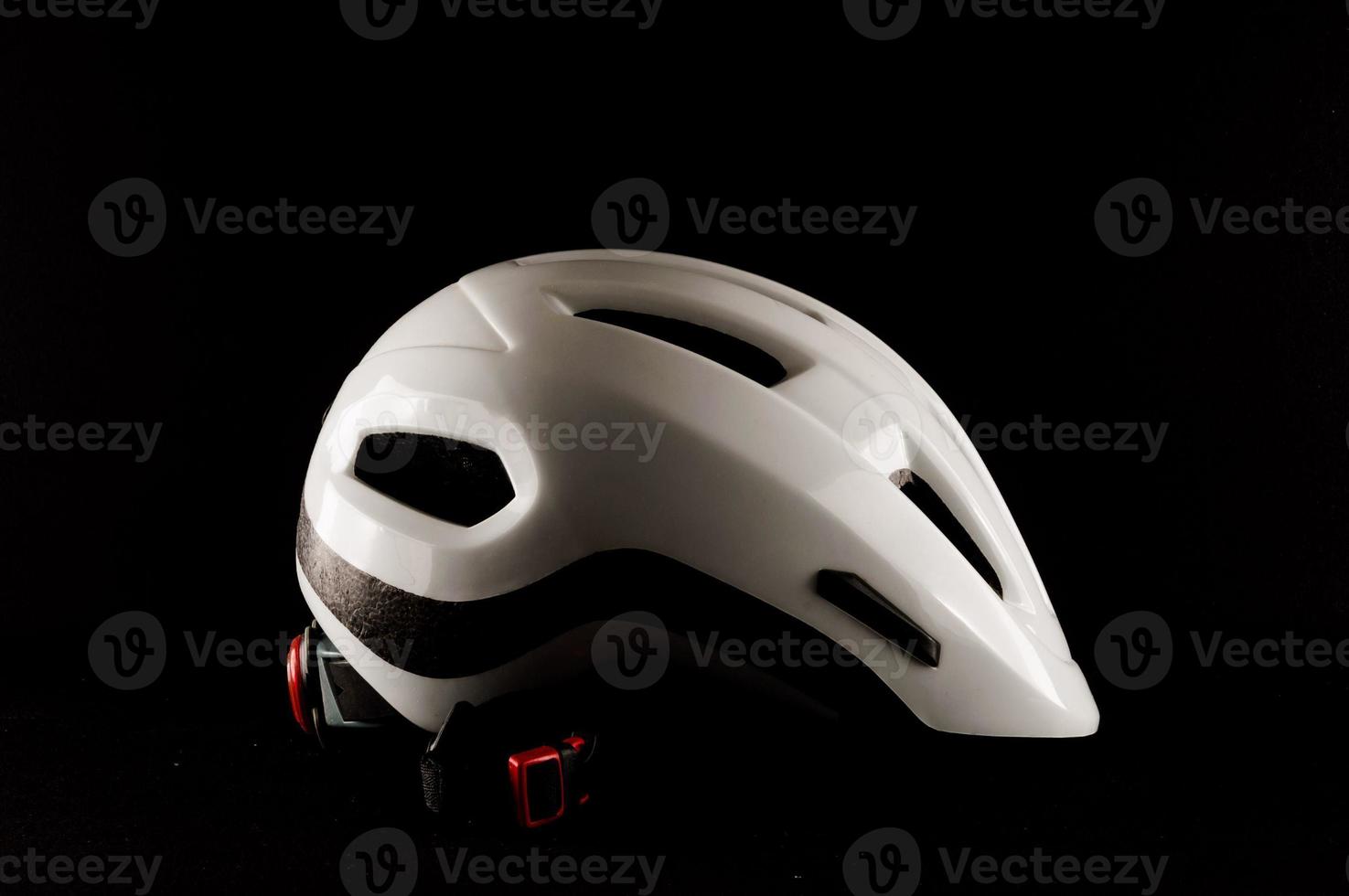 Bicycle helmet on black background photo