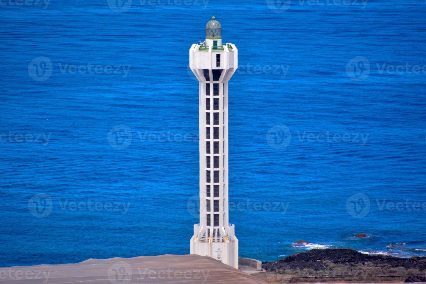 Lighthouse by the sea photo