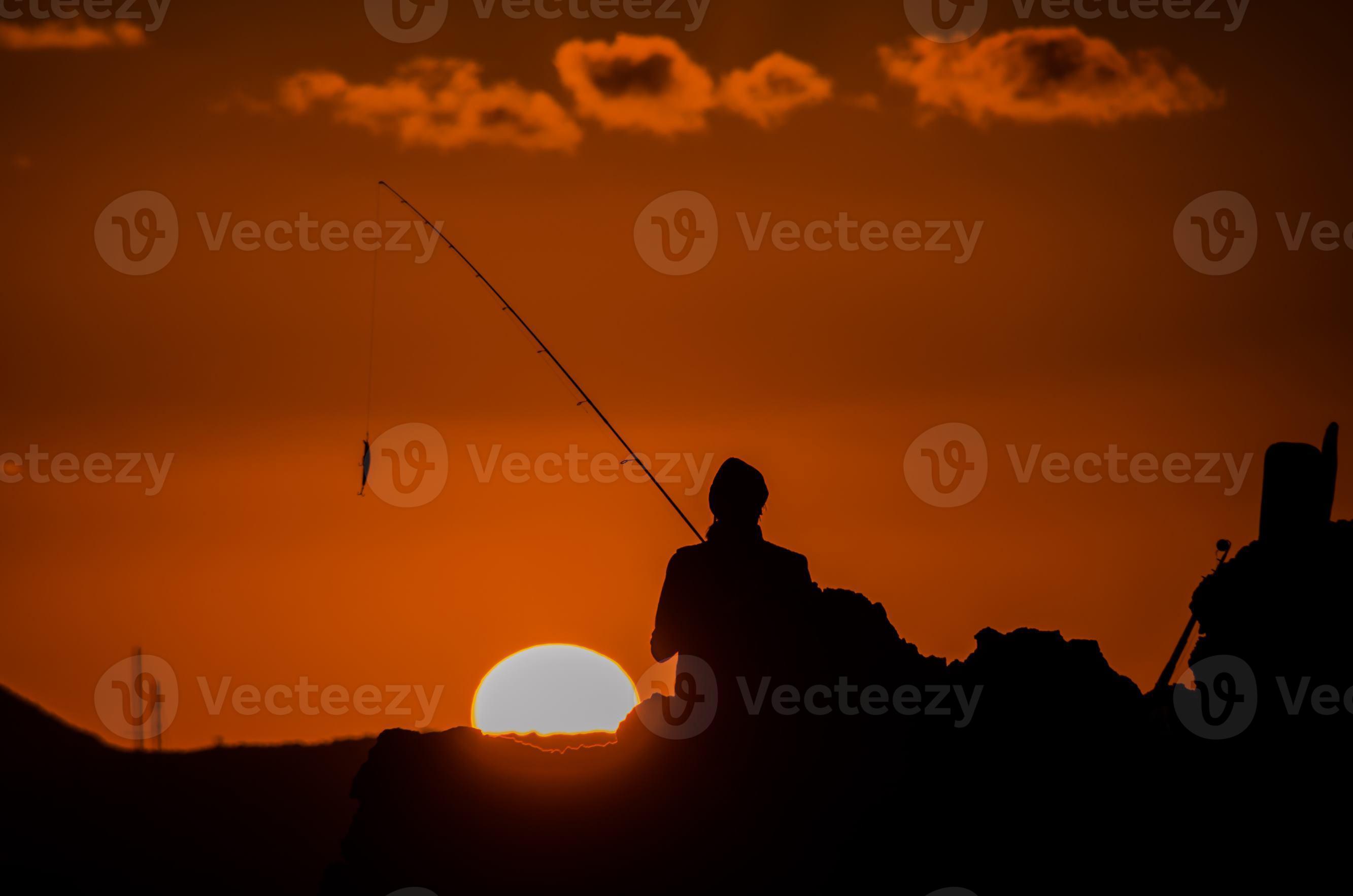 Silhouette of a fisherman 19073470 Stock Photo at Vecteezy