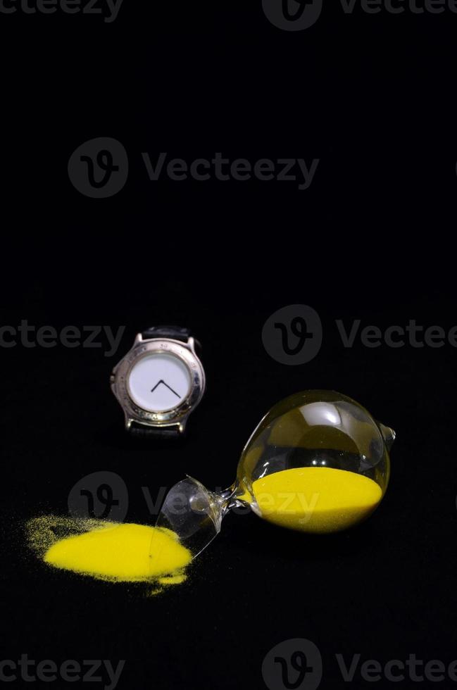 Clock and broken hourglass photo